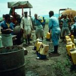 Papua New Guinea. Sugarcane Farm. Paraquat Mixed 100:1 For Loading Into Backpack Sprayers.