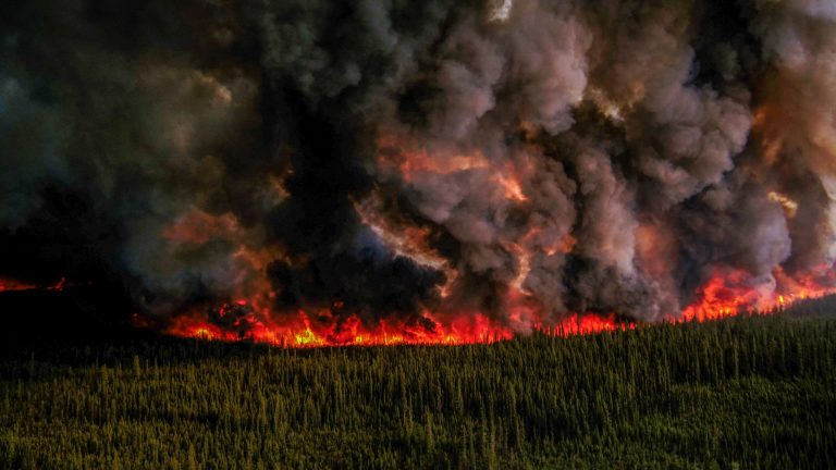 Smoke Billows Upwards From A Planned Ignition By Firefighters Tackling The Donnie Creek Complex Wildfire South Of Fort Nelson