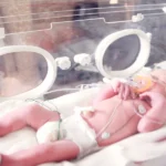 Baby Lying In Incubator