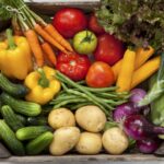 Crate Of Fresh Summer Vegetables From A CSA.