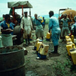 Papua New Guinea. Sugarcane Farm. Paraquat Mixed 100:1 For Loading Into Backpack Sprayers.